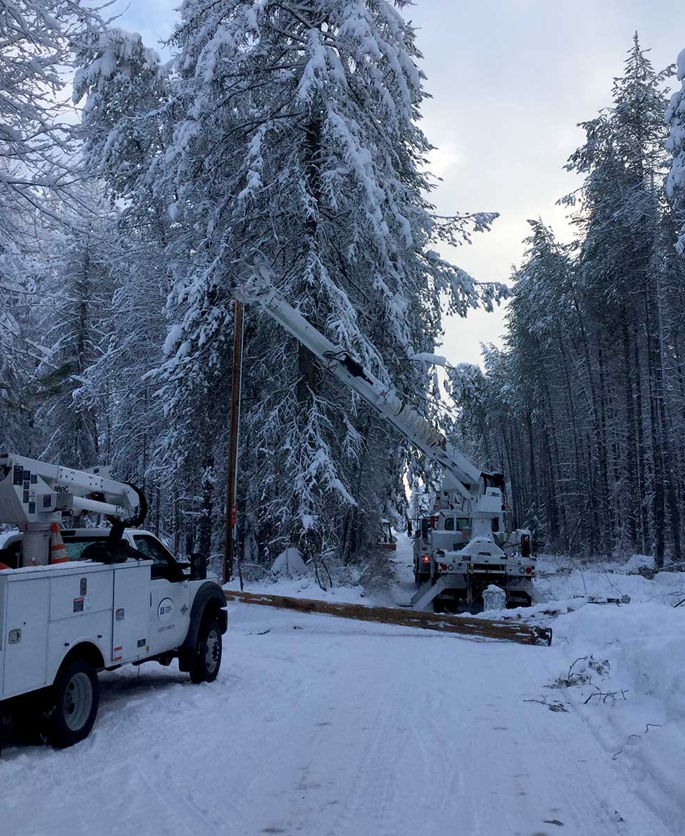 Transmission line repair in a snowy forest